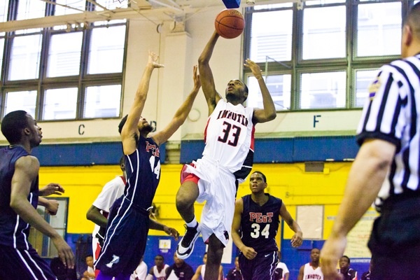 Imhotep's Jalil Myers goes to the hoop. (Brad Larrison/for NewsWorks)
