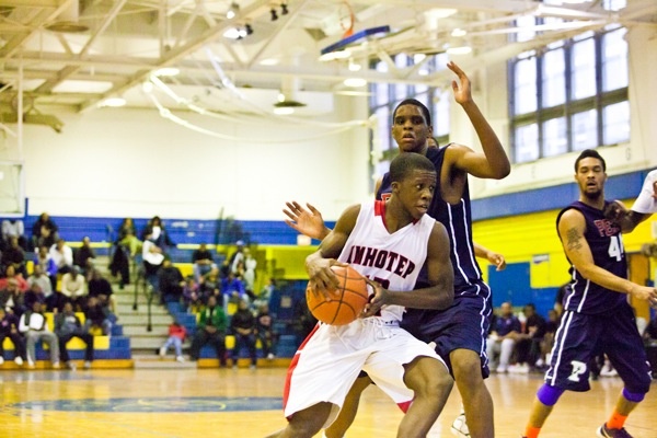 Jakwan Jones of Imhotep Charter moves up the court in his team's 51-43 win over Philadelphia Electrical on Saturday. (Brad Larrison/for NewsWorks)
