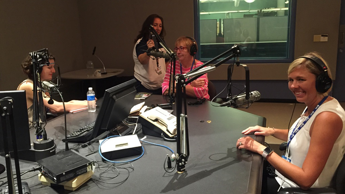 As WHYY engineer Diana Martinez adjusts a microphone, journalist Anne Hoffman (from  left) interviews co-authors Mary Ryan Woods and Adrienne Murray (Photo by Megan Lepore) 