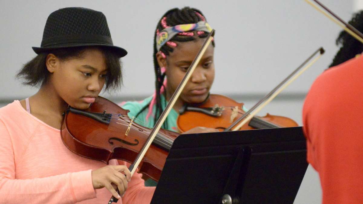 Early in the evening, students from Cooke elementary performed 'Hotline bling' by Drake. Music teacher Matt Haydt criticized Cooke's former principal and said replacement has been 'killing it...and that's a good thing.' (Bastiaan Slabbers for WHYY)
