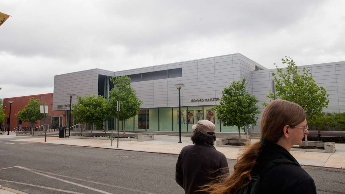 Participants in the Jane's Walk pass by Drexel University's URBN Center for Arts and Design which was opened in 2013.