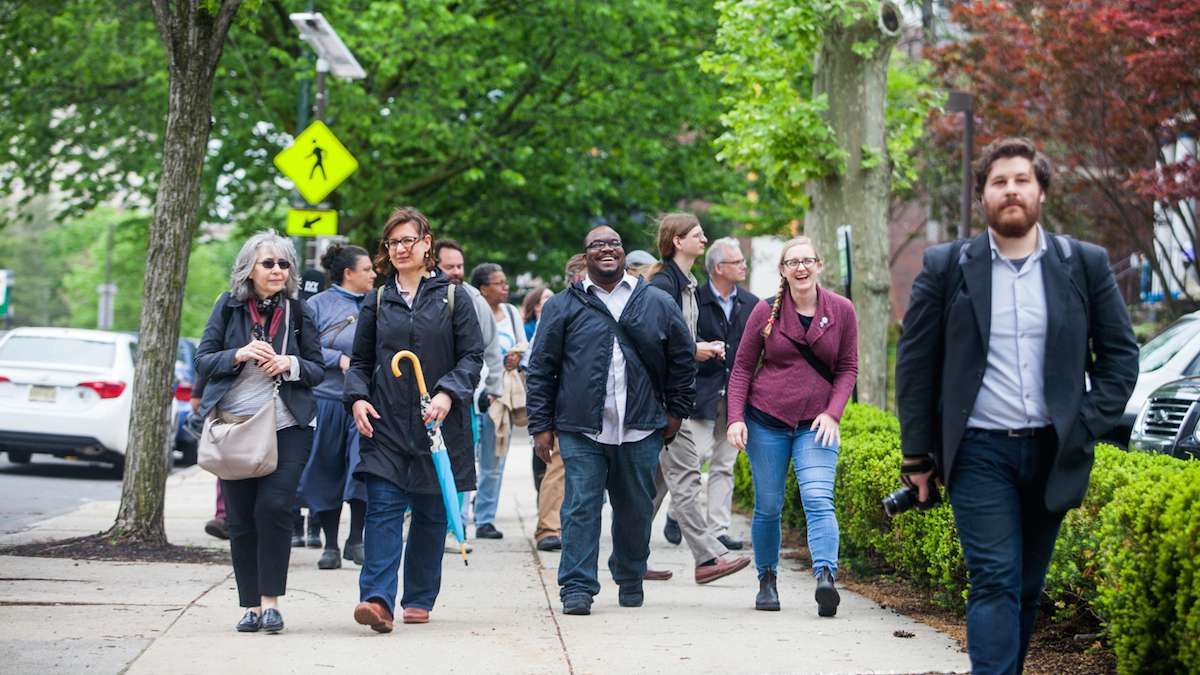 The group of participants in Friday's Jane's Walk head down Lancaster Avenue through University City.