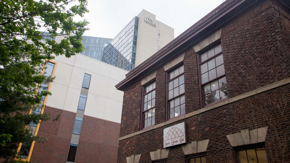 The Community Education Center on Lancaster Avenue, constructed in 1901, is seen with newer construction in the background.