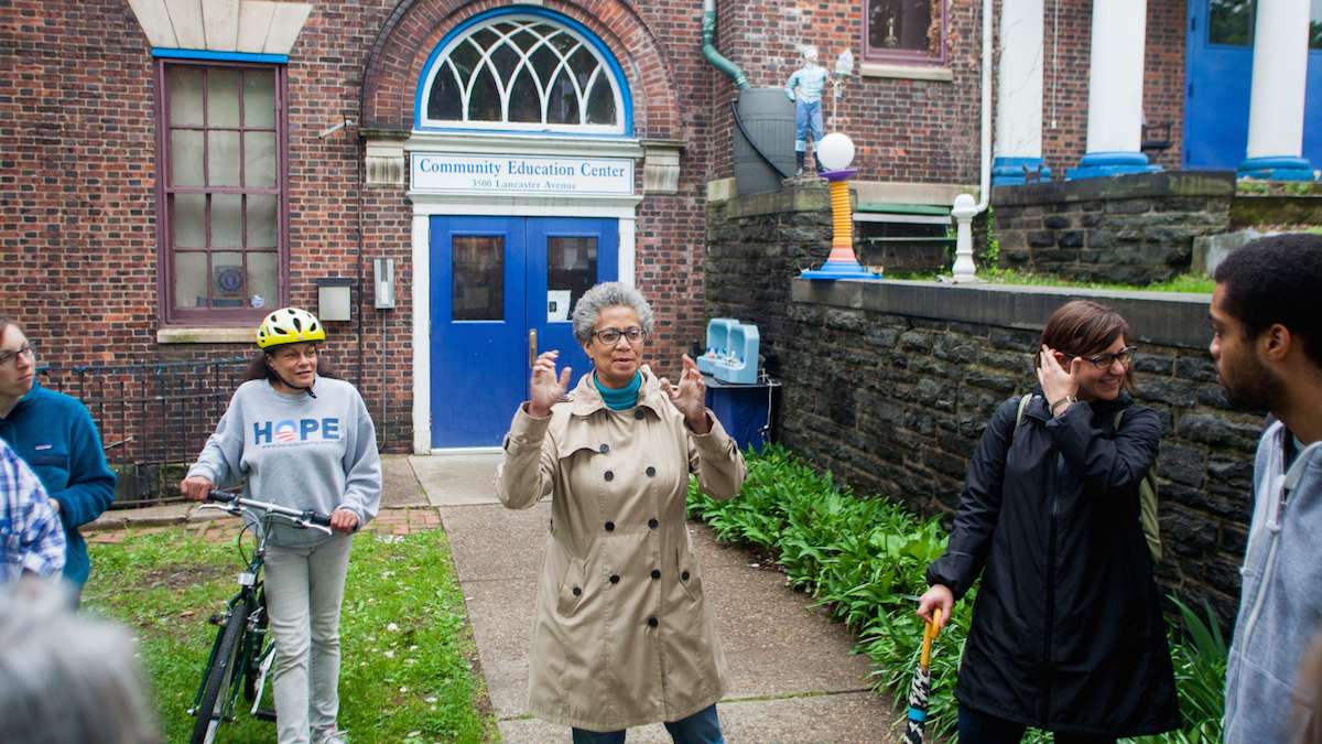 Terri Shockley speaks to Jane's Walk participants about some of the history and workings of the Community Education Center and meeting house on Lancaster Avenue near Powelton Avenue.