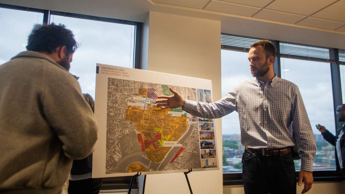 Peter Cramer of Wexford Science and Technologies goes over a map of current and proposed development in and around University City at the beginning of a Jane's Walk through the neighborhood Friday.