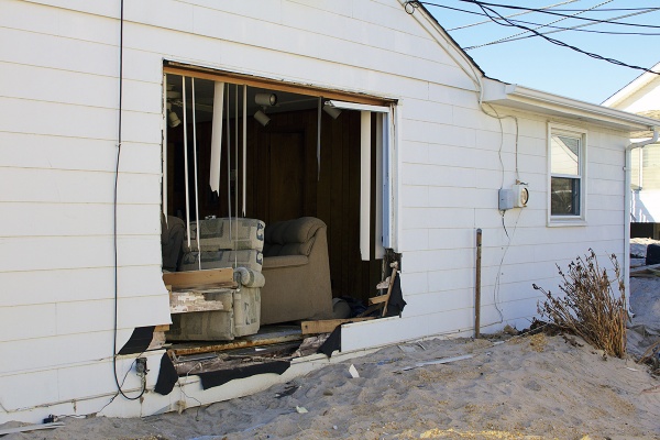 <p>Sandy left a gaping hole in the side of a home in nearby Ortley Beach. ( Jana Shea /for NewsWorks )</p>

