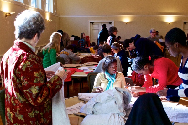 <p>Volunteers from area churches write victims' names on shirts inside the Presbyterian Church of Chestnut Hill.  ( Jana Shea /for NewsWorks )</p>
