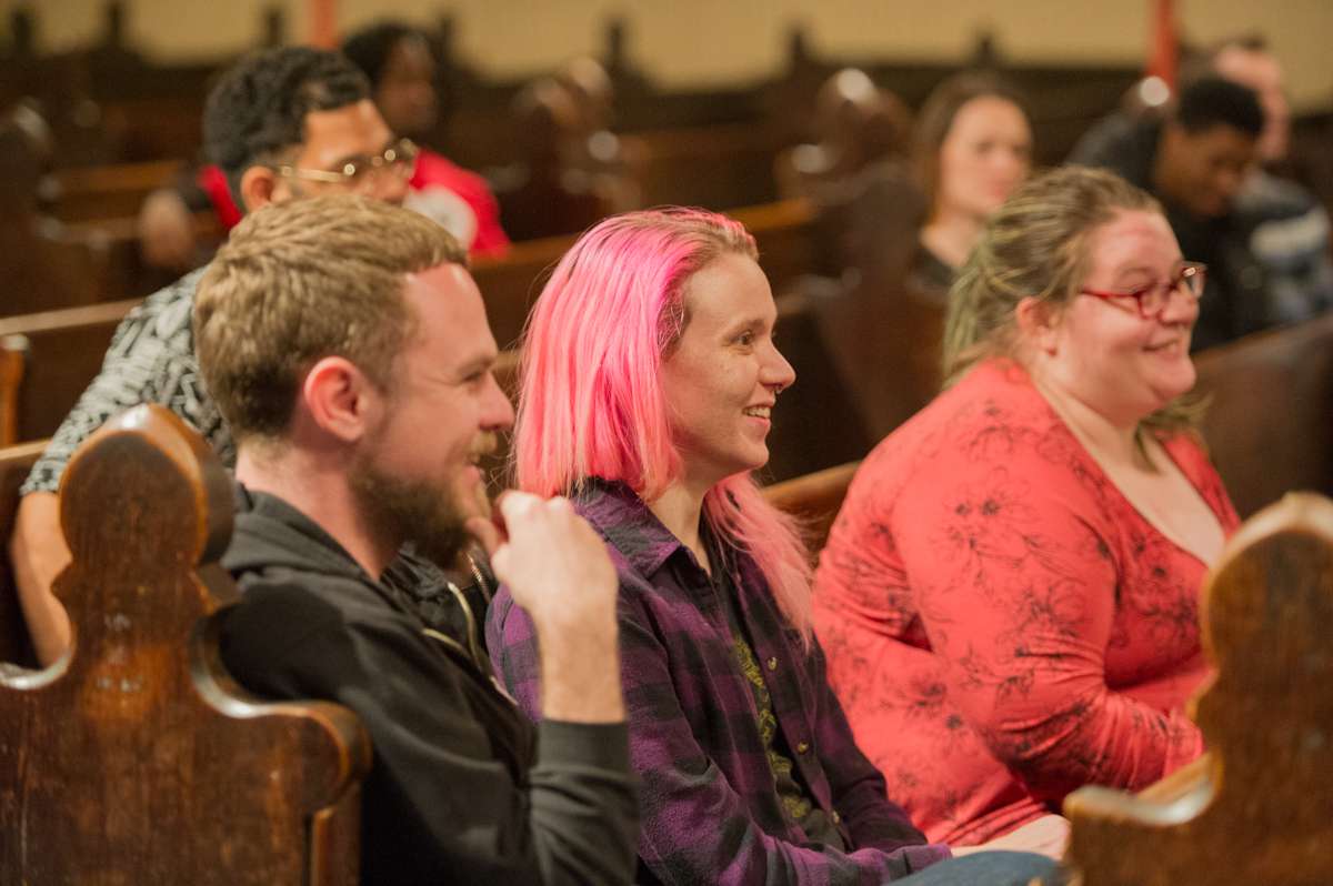 Attendees listen to members of Up Against The Law Legal Collective explain protesters' rights at a training at the First Unitarian Church of Philadelphia.