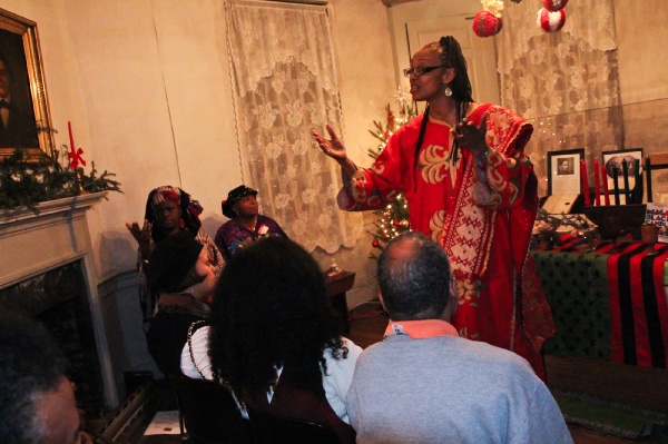 <p><p>Denise Valentine, a storyteller with Keepers of the Culture, tells a Kwanzaa story at the historic Johnson House in Germantown. (Kimberly Paynter/WHYY)</p></p>
