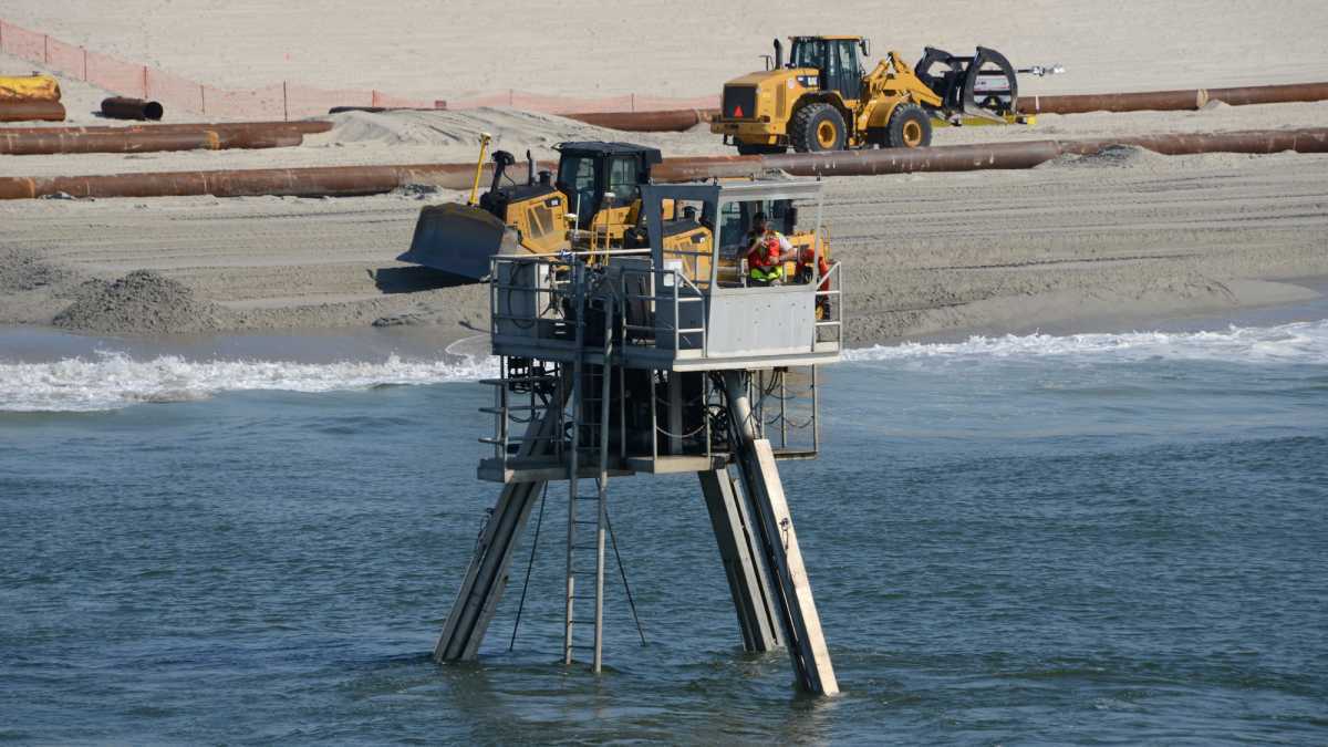  A Coastal Research Amphibious Buggy (CRAB) surveys the surf area of Brant Beach, NJ during a restoration project in June of 2013. (Photo by USACE) 