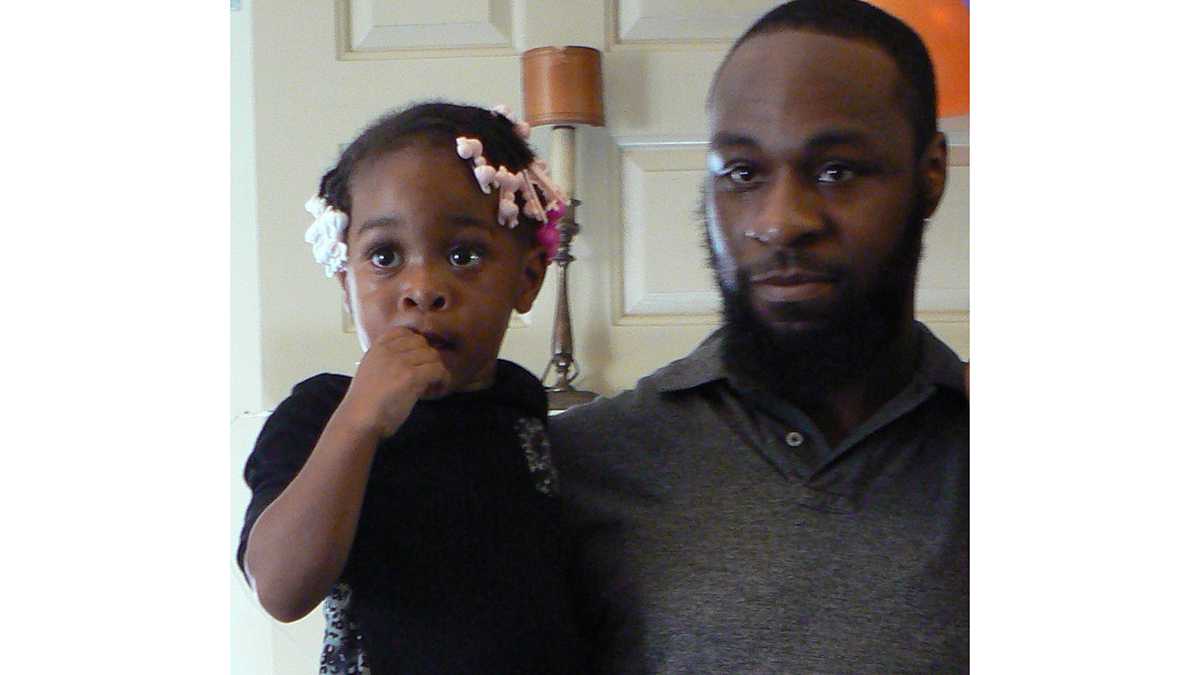  Tyree Carroll holds his daughter.(Carroll family photo) 