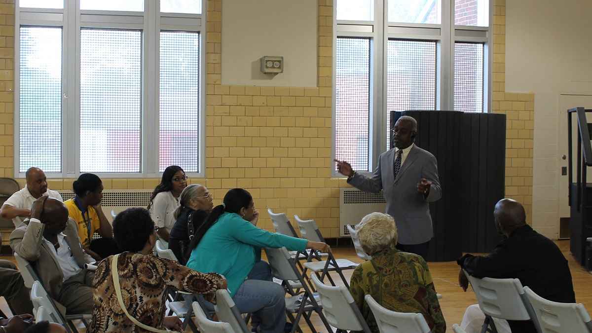  Anthony Murphy, executive director of the city's Town Watch Integrated Services, spoke with East Germantown residents in the wake of the alleged serial rapist's arrest. (Matthew Grady/for NewsWorks) 