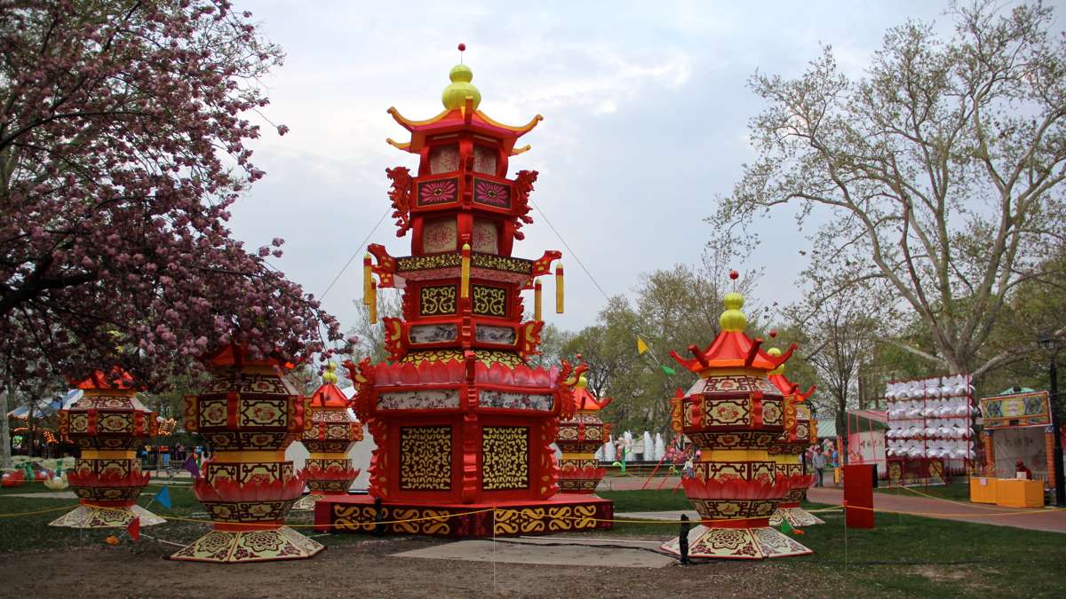  The Chinese Palace Lantern is brushed by the boughs of a cherry tree. (Emma Lee/WHYY) 