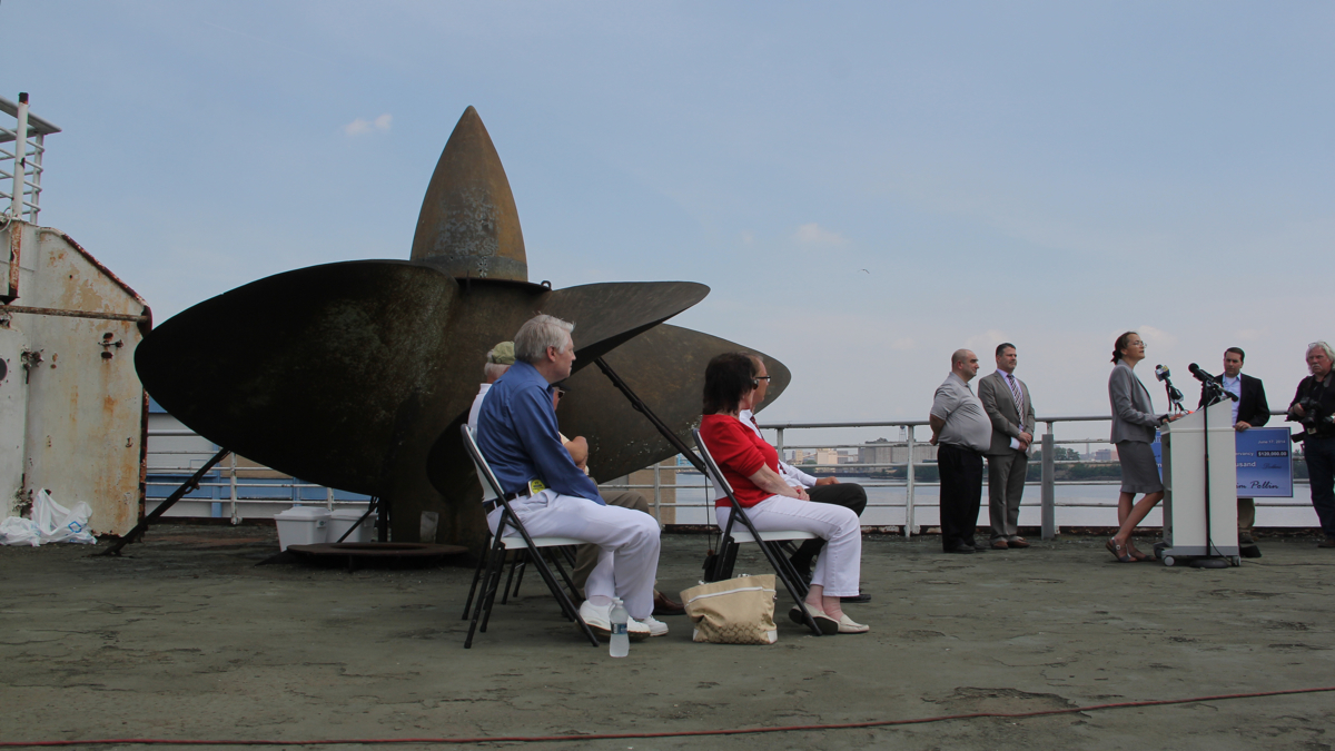  Supporters of the SS United States Conservancy gather on the deck of the ship to celebrate the $120,000 donation that saved the ship's last propeller. (Emma Lee/WHYY) 