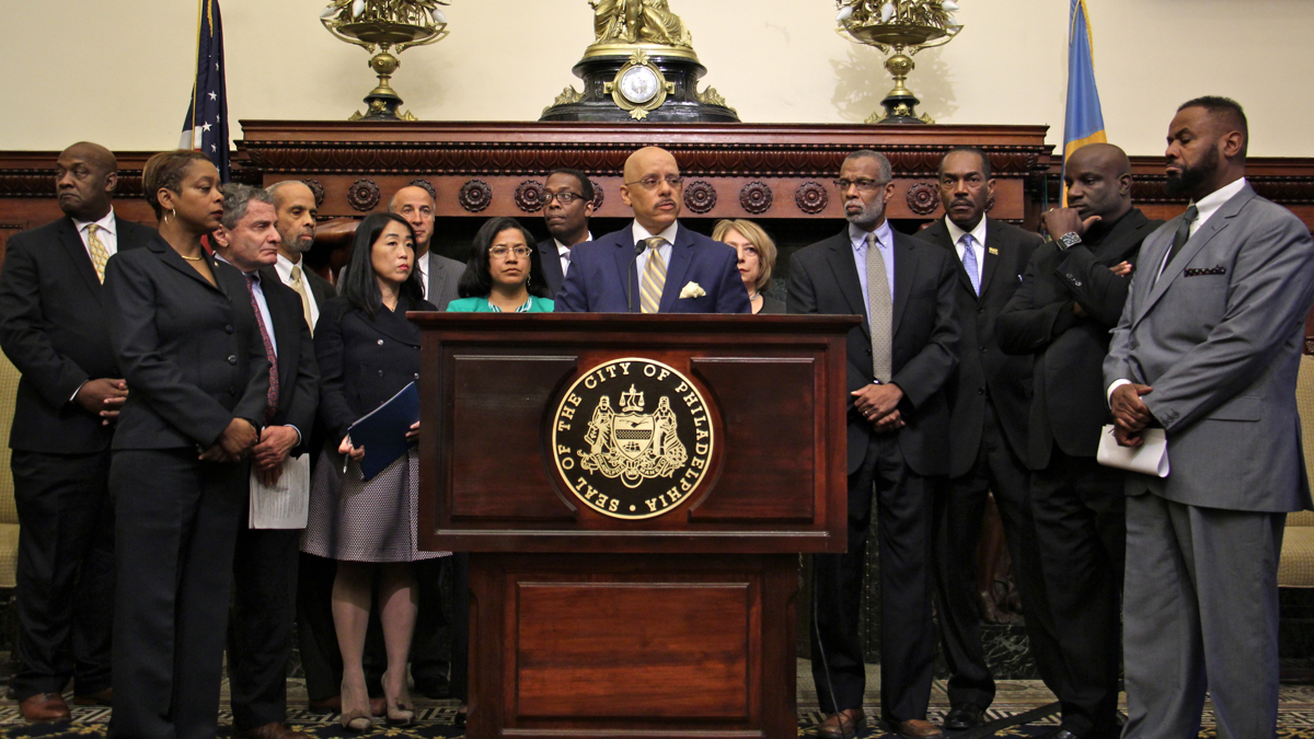 Pennsylvania state Sen. Vincent Hughes (center) joins state and local lawmakers and community leaders in a call to action in response to reports of high lead levels in children. (Emma Lee/WHYY)