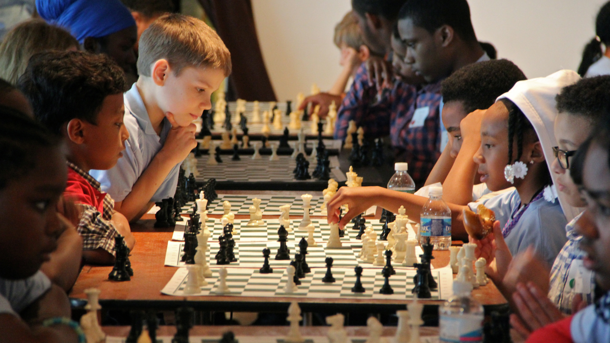  More than 200 children from 23 Philadelphia schools converge at Independence Seaport Museum for a taste of tournament chess. (Emma Lee/WHYY) 