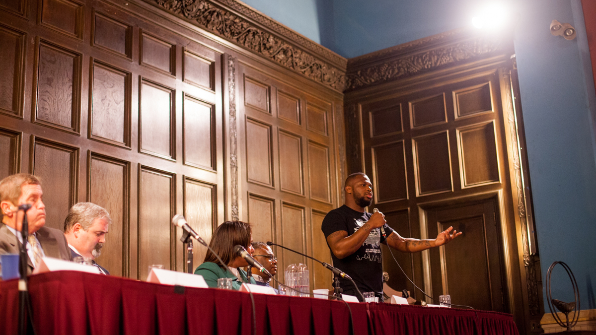  Joshua Glenn speaks at a forum on ending the cash bail system in Philadelphia Thursday at the First Unitarian Church. Glenn was held for 18 months when he was 16 after not being able to post bail. (Brad Larrison for NewsWorks) 