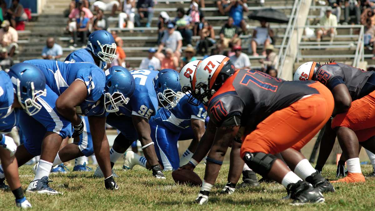 At O'Shields-Stevenson Stadium, Cheyney University Wolves (in blue) and Lincoln University Lions face off during the 'Battle of the Firsts.' Cheyney is the country's oldest institution of higher learning for black students, while Lincoln was the first one to grant degrees. (Bastiaan Slabbers/for NewsWorks)