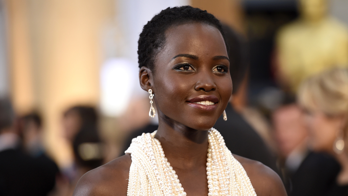 Lupita Nyong'o arrives at the Oscars on Sunday, Feb. 22, 2015, at the Dolby Theatre in Los Angeles. (Photo by Chris Pizzello/Invision/AP)
