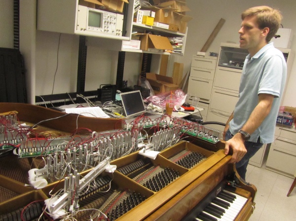 The electromagnet rigging is portable can be removed from the old, battered piano in Drexel's music and entertainment technology lab and reinstalled in a concert grand in a few hours. (Peter Crimmins/For NewsWorks)