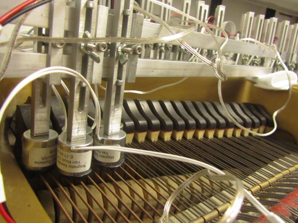 The MRP is a standard piano rigged with electromagnets a fraction of an inch above each of its strings. (Peter Crimmins/For NewsWorks)