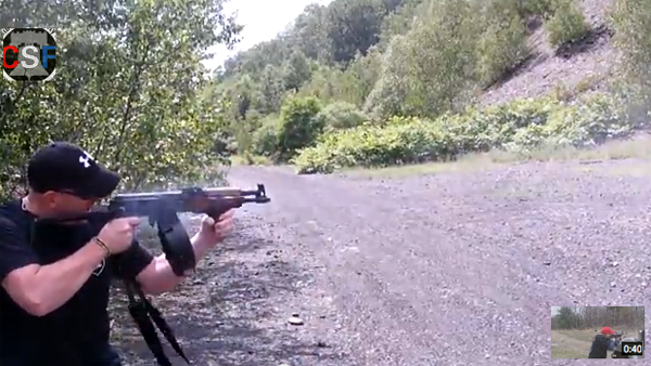  In this screen capture from Mark Kessler's mock-apology video, the Gilberton, Pa., police chief can be seen firing one of several weapons. 