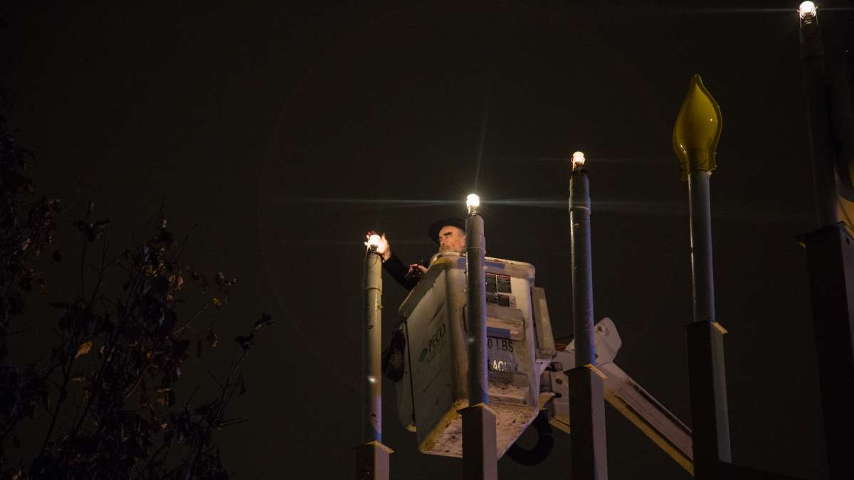 Rabbi Abraham Shemtov, the regional director of Chabad Lubavitch, says the blessings and lights the candles for the third night of Hanukkah, December 26, 2016.