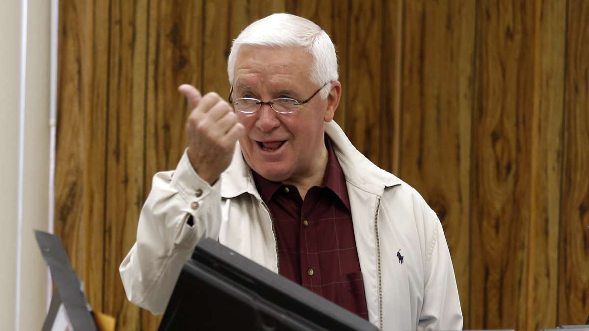 Pennsylvania Governor Tom Corbett jokes with photographers as he casts his vote in Shaler Township, Pa. on Tuesday, Nov. 4, 2014. (Keith Srakocic/AP Photo)