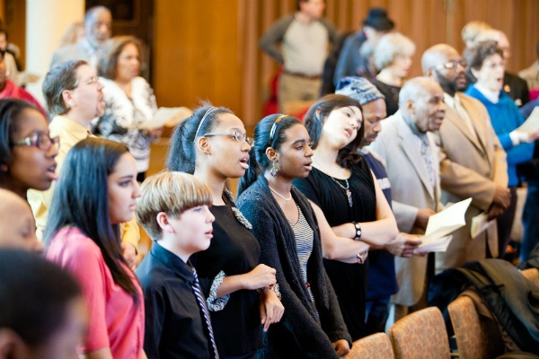 <p><p>Members of the Second Baptist Church Youth Choir sing along to a song before their own performance during an MLK-inspired interfaith service at Germantown Jewish Centre in Mount Airy. (Brad Larrison/for NewsWorks)</p></p>
