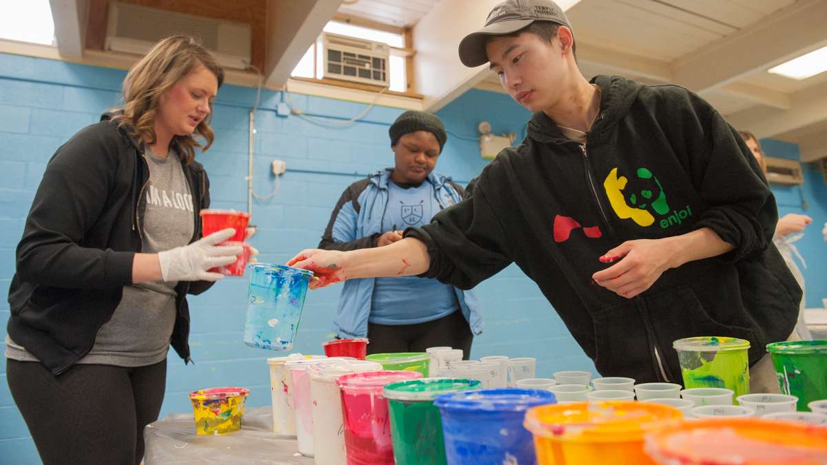 At Capotolo Playground Center in South Philadelphia (from left) Ann Kramer, Meniyah Miller, and Alex Kim prepare paint.
