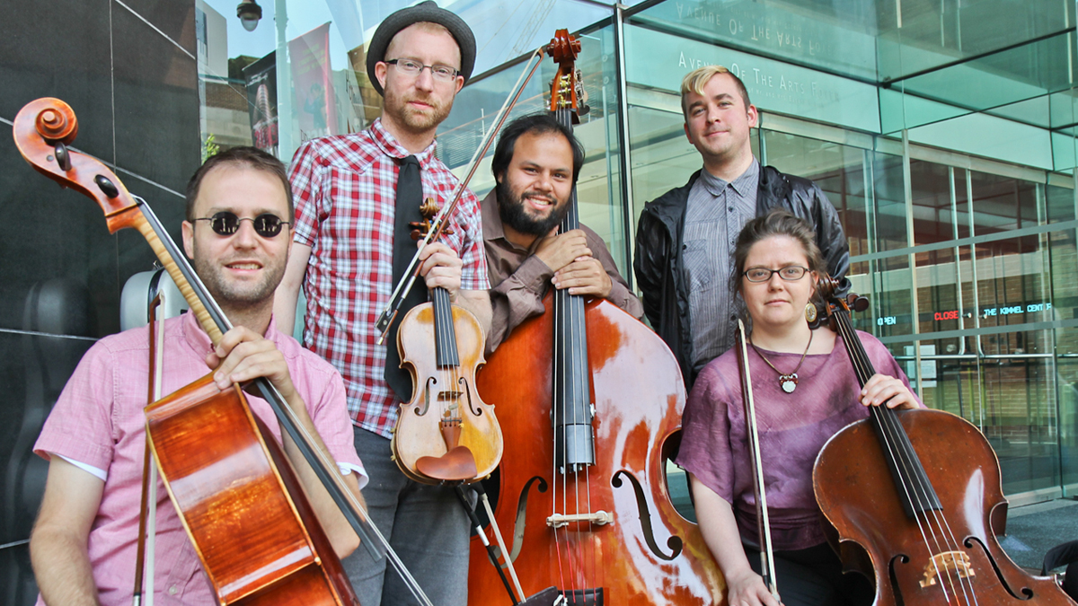  Members of the music ensemble Murmuration perform improvised classical music outside of the Kimmel Center as part of the citywide Make Music Philly event June 21. (Kimberly Paynter/WHYY) 