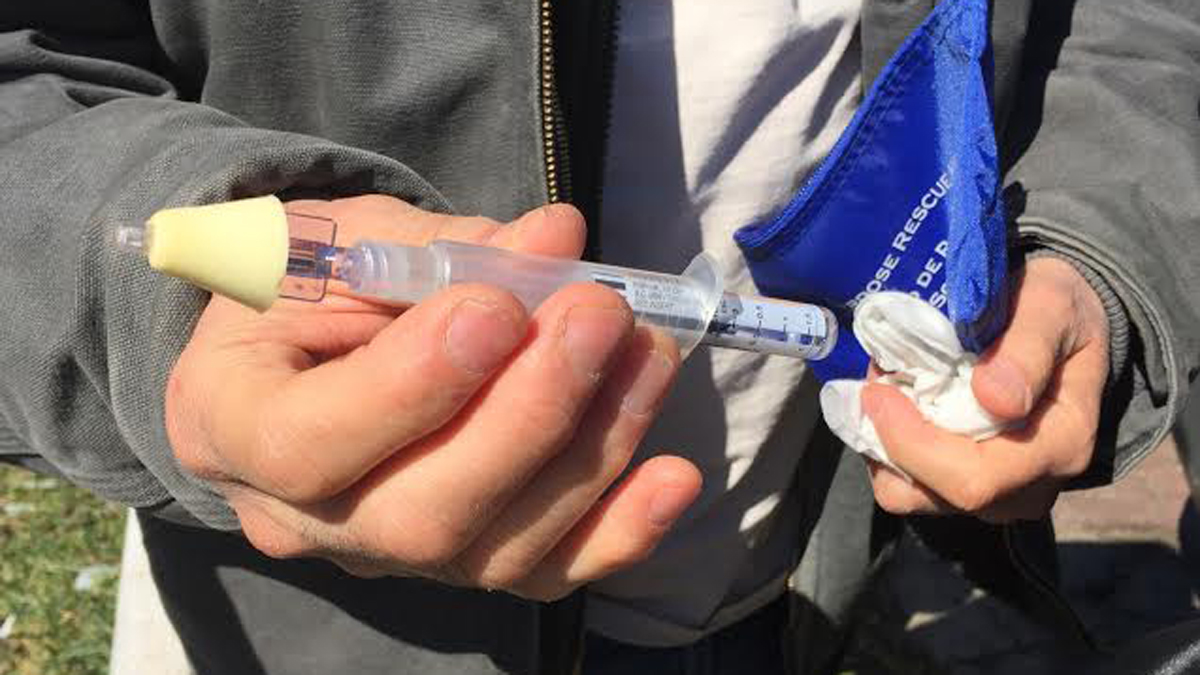 Paul Cherashore of the Philadelphia Overdose Prevention Initiative holds a dose of naloxone, an antidote for opioid overdoses. (Courtenay Harris Bond) 
