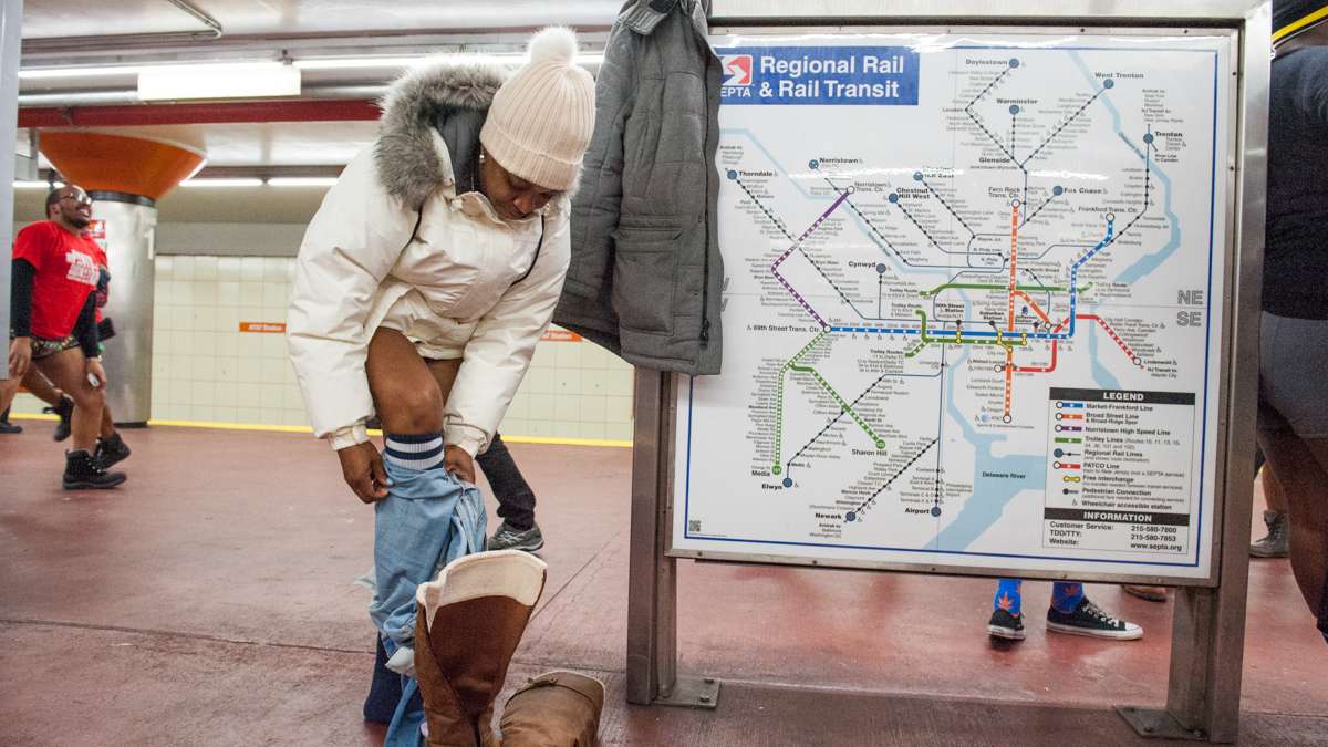 No Pants organizer Takiyah Wall sheds her jeans at the AT&T subway station.