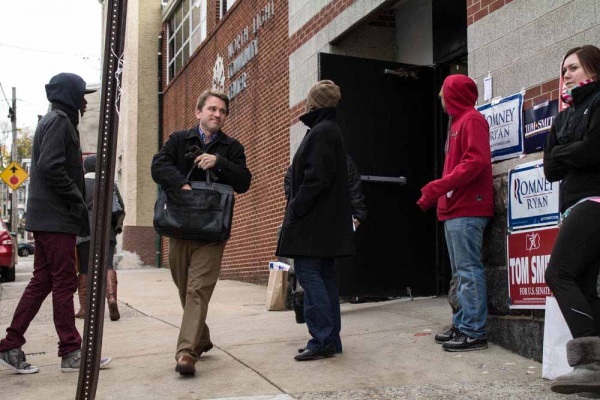<p><p>One voter walks out of North Light Community Center on Tuesday morning after casting his ballot. (Francis Hilario/for NewsWorks)</p></p>
