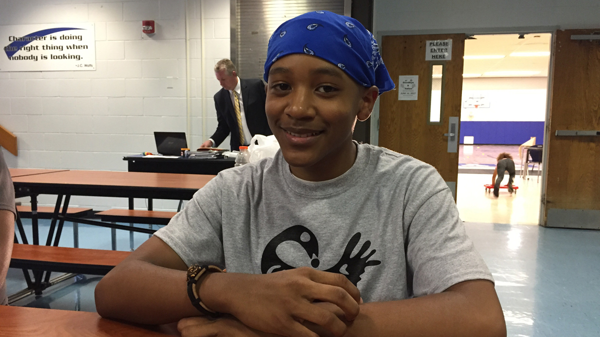  Ryan Olan, rising sophomore, is traveling to Ghana with classmates from  Mastery High School of Camden.(Avi Wolfman-Arent/WHYY) 