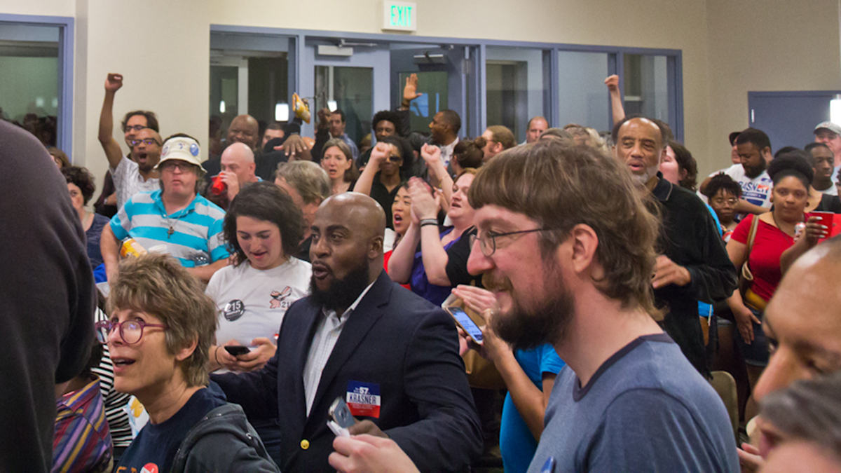  Supporters of Democratic primary winner Larry Krasner react to the news of his winning at Krasner’s campaign party Tuesday night. (Kimberly Paynter/WHYY) 
