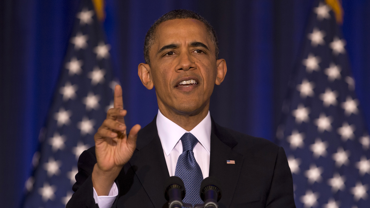  President Barack Obama reacts to a woman yelling at him from the back of the auditorium as he talks about national security on May 23, 2013, at the National Defense University at Fort McNair in Washington. (AP Photo/Carolyn Kaster) 