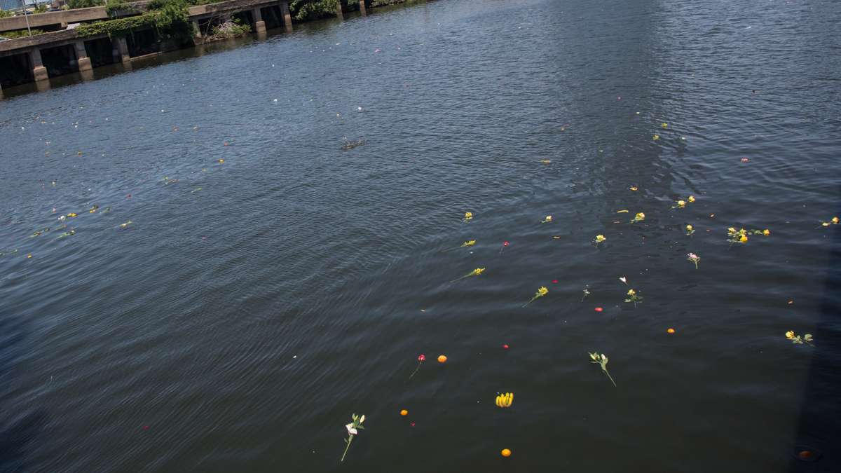 Offerings for Oshun, the Yoruba river goddess, float away on the Schuylkill River.