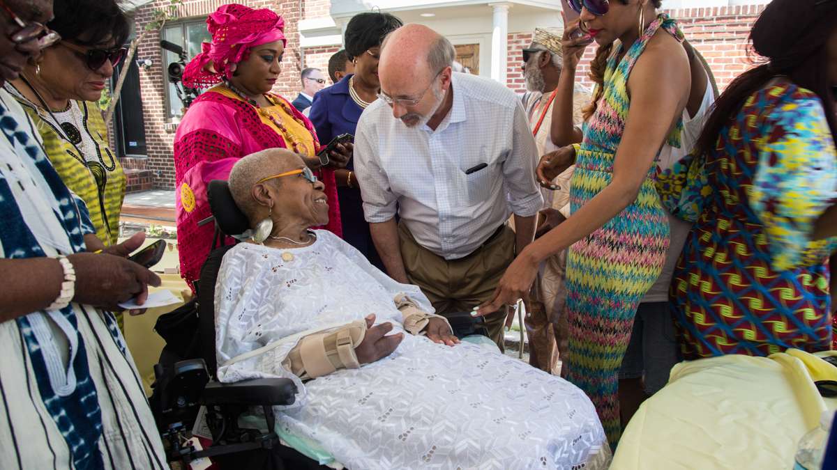 Lois Fernandez, 80, who helped to found the celebration of African culture in 1975, talks with Pennsylvania Gov. Tom Wolf at the 42nd Annual Odunde Festival.