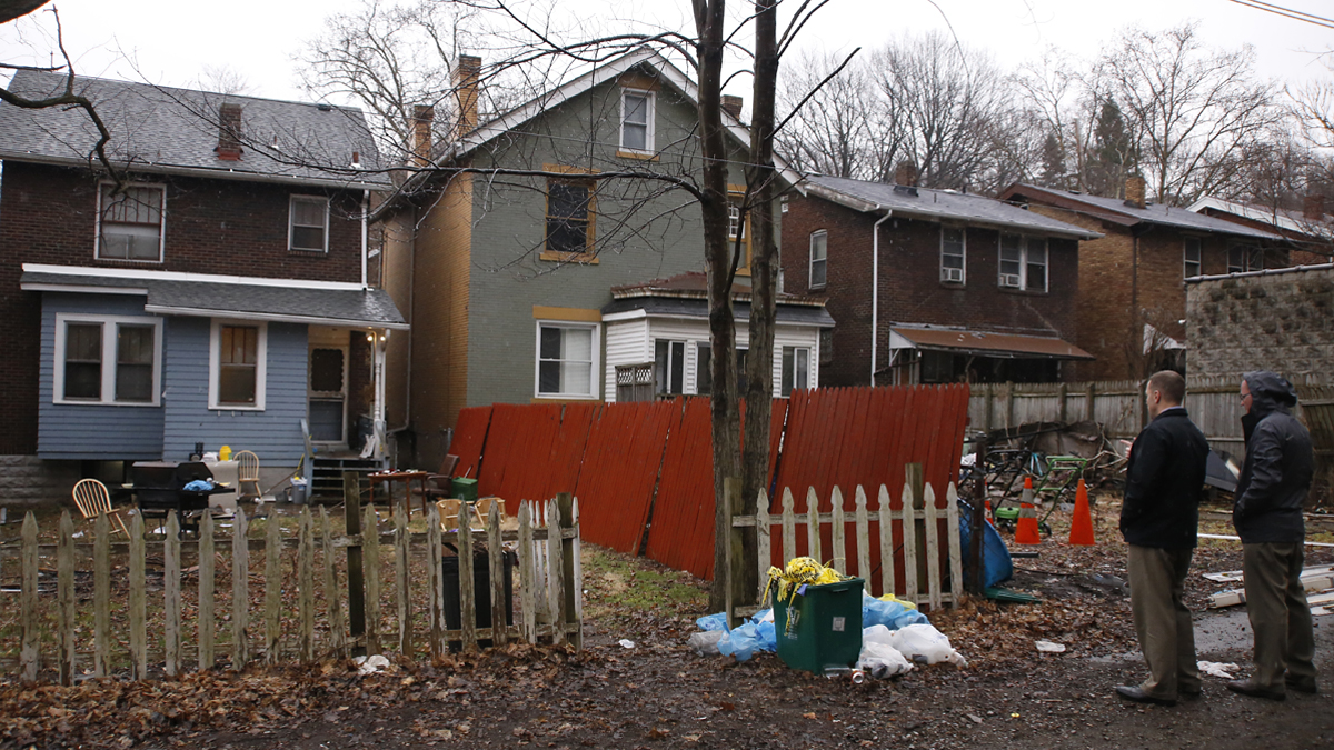  Allegheny County detectives look over the scene of a shooting March 10, 2016, in Wilkinsburg, Pa.   (Keith Srakocic/AP Photo) 