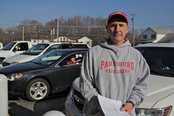 <p>With schools closed because of a chemical spill, Paulsboro High School principal and wrestling coach Paul Morina organizes a practice in Gibbstown. (Emma Lee/for NewsWorks)</p>
