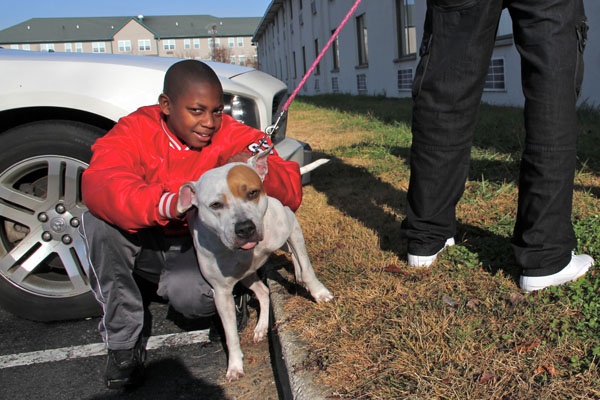 <p>Isaiah Generette is staying at the Motel 6 off I-295 in Swedesboro with his mother, stepfather, and their dog, Dream, while their home on East Adams Street in Paulsboro is under evacuation. (Emma Lee/for NewsWorks)</p>
