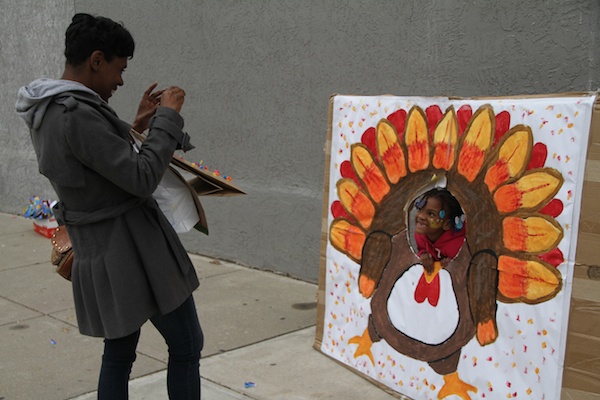 <p><p>Lynndrena Neal snaps a few photos of her daughter at the fall festival. (Trenae V. McDuffie/for NewsWorks)</p></p>
