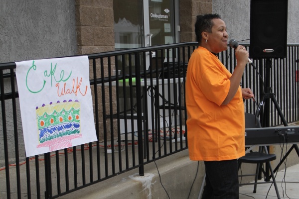 <p><p>Author/rapper Kim Beverly sings as the PCAT line dancers do their thing. (Trenae V. McDuffie/for NewsWorks)</p></p>
