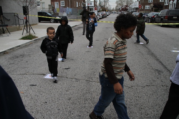 <p><p>Children play the "cake walk" game — similar to music chairs — to win a free homemade cake. (Trenae V. McDuffie/for NewsWorks)</p></p>
