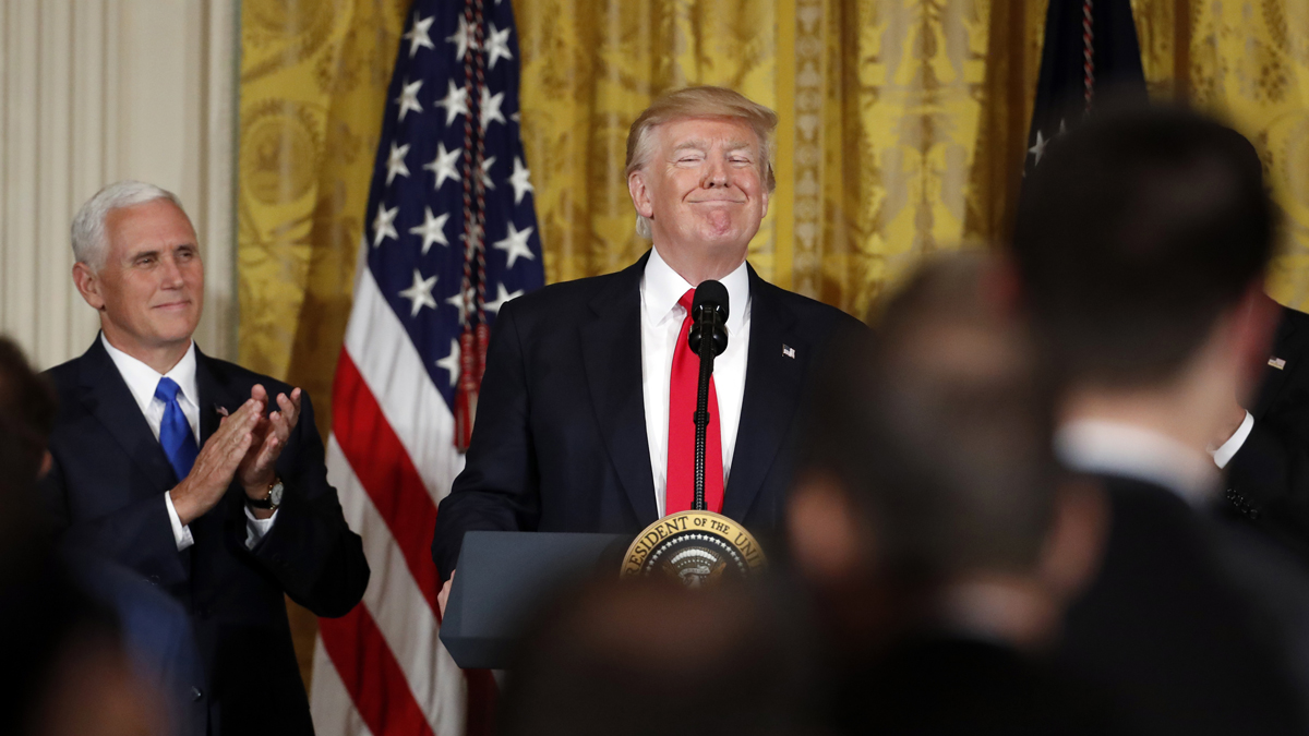  President Donald Trump, accompanied by Vice President Mike Pence, smiles as he finishes speaking in the East Room of the White House, Wednesday, July 26, 2017, in Washington. (AP Photo/Alex Brandon, file) 