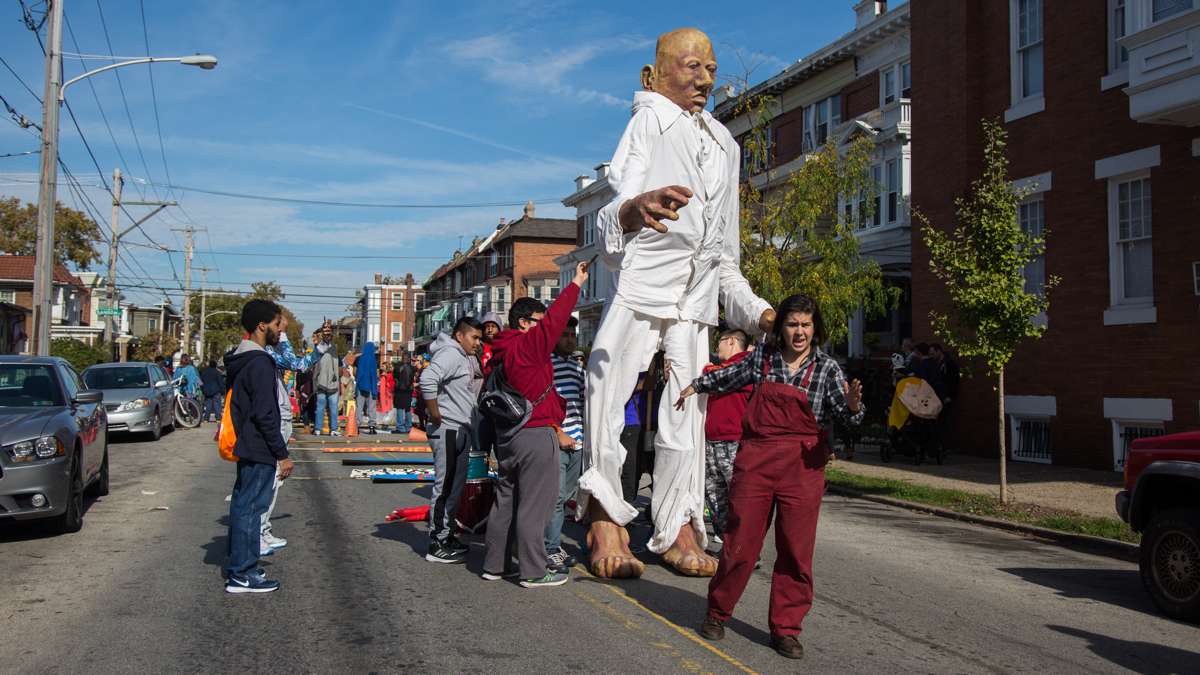 Rachel Adler, from Spiral Q, teaches with teenagers from the Youth Volunteer Corps how to make the giant puppet appear to be walking. The theme for this years annual Peoplehood parade was ''We might all be giant.''