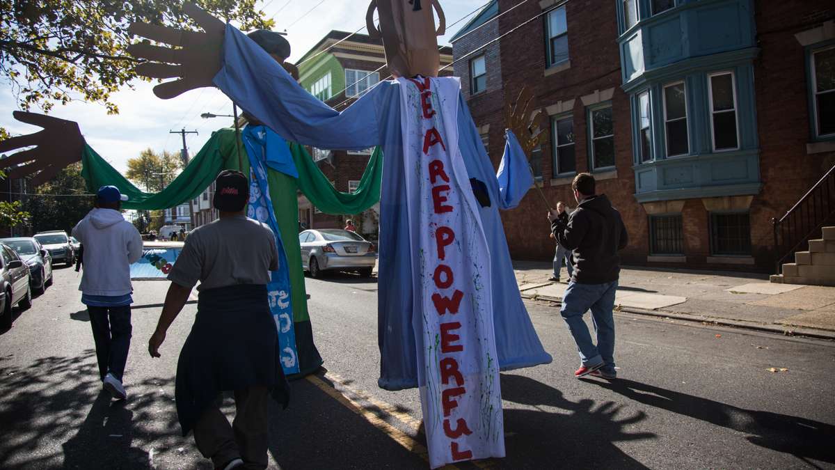 Representatives of Girard Medical Center carry the giant puppets they created for the 17th annual Peoplehood parade Oct. 29, 2016.