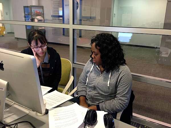 <p><p>Yowei Shaw reads over Jaya Montague's script. (Jeanette Woods/ NewsWorks)</p></p>
