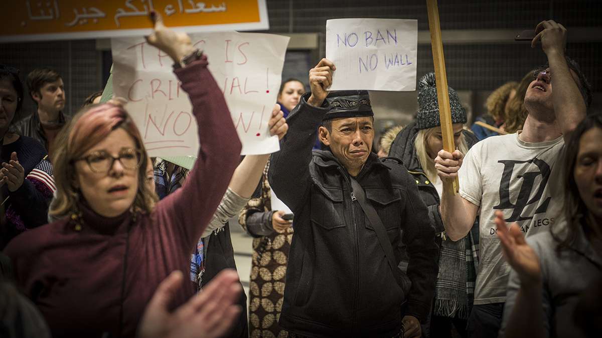 Protesters angered by President Donald Trump’s executive order that prevented refugees, visa and green card holders from entering the US chant pro-immigration slogans at Philadelphia International Airport. (Branden Eastwood for NewsWorks)